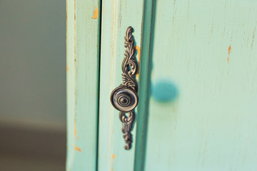 Wooden nightstand with round handles close-up