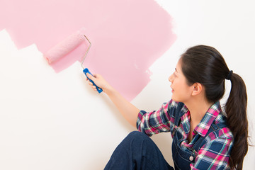 woman portrait while painting new apartment
