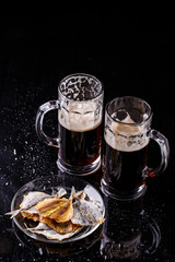 Glasses of beer with fish