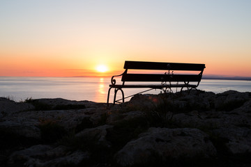 Sunset beach and bench