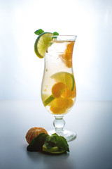 Fruit lemonade in hurricane with orange mint and lime