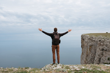 Man on top of mountain watch to the sea