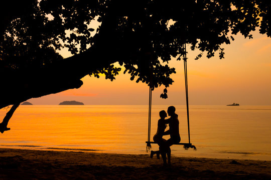 Beautiful couple on swing Thailand