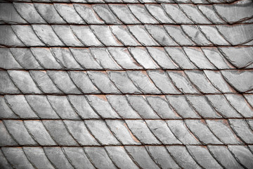 Genuine black slate shingle tiles on a roof in Winterberg in Germany