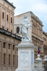 Fototapeta na wymiar Scultpure of Saint Peter in front of Syracuse Cathedral on Ortygia isle, Syracuse city, Sicily Island in Italy