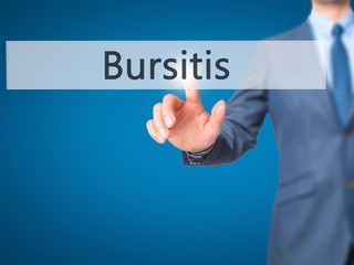 Bursitis - Businessman hand pressing button on touch screen interface.