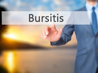 Bursitis - Businessman hand pressing button on touch screen interface.