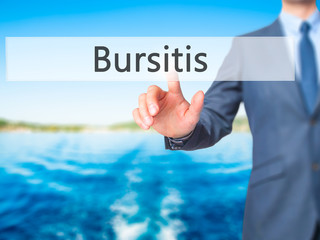 Bursitis - Businessman hand pressing button on touch screen interface.