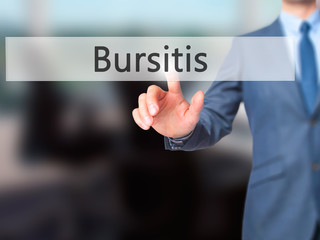 Bursitis - Businessman hand pressing button on touch screen interface.