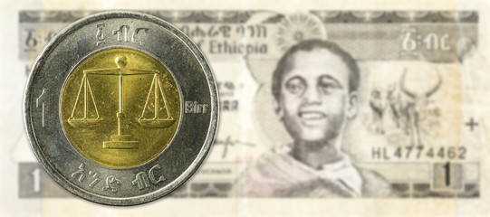 1 birr coin against 1 ethiopian birr bank note obverse