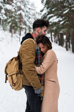 Couple embracing in forest