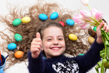 happy easter girl, colorful eggs in long hair, tulip flowers