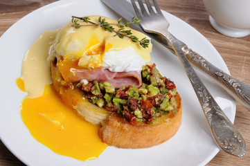 Toast with guacamole with egg Benedict