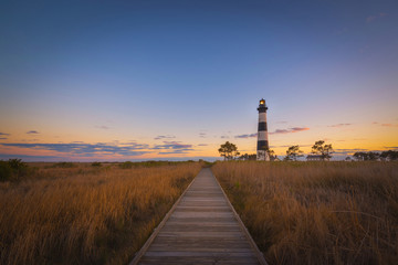 Boardwalk leading to Bodie Island Lighthouse at sunset 