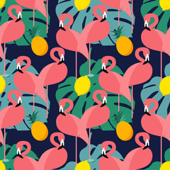 Seamless vector background with pink flamingos on a dark blue background.