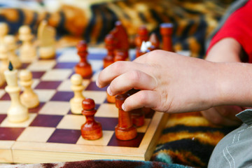 boy takes a chess rook