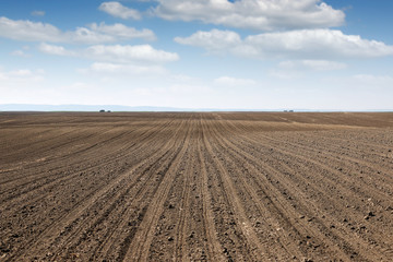plowed field  country landscape spring season agriculture