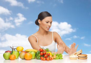 woman with fruits rejecting fast food