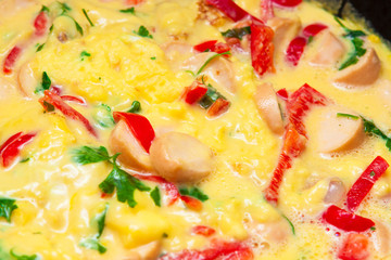 Omelette with sausages and sweet pepper