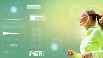 happy woman with earphones running over green