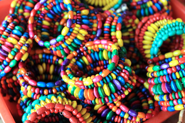 Women handmade bracelet, exposed for sale. Colorful handcraft made by mud.