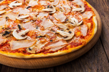 Delicious pizza with mushrooms and smoked chicken