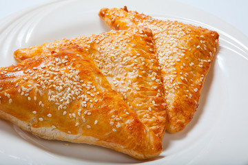 Homemade cheese puff pastries on a white plate