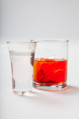 Vodka and a cocktail on a white background