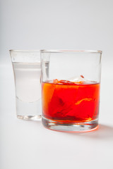 Fototapeta na wymiar Vodka and a cocktail on a white background