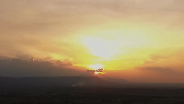 view aerial photo from flying drone of a beautiful sunset with blue sky and clouds.