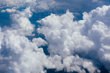 Naklejka na ściany i meble White velvet clouds in the sky, view from the airplane.
