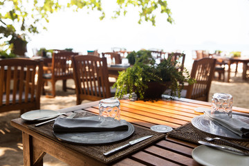 served table at open-air restaurant on beach