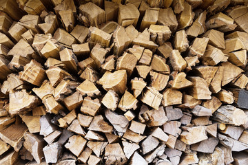 Many stacked firewood for the fireplace