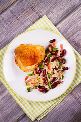 Chicken with Rice, Beans, Bacon and Green Pepper on White Plate