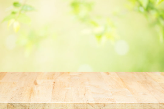 Wood table top on blurred background,used for display products