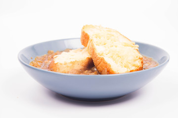 Onion soup with toast on a white background
