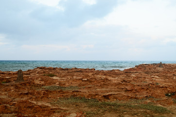 Fototapeta na wymiar Rocky red sea shore