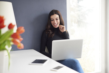 Home office is the best solution. Shot of a young thoughtful woman working on a computer in her home office.