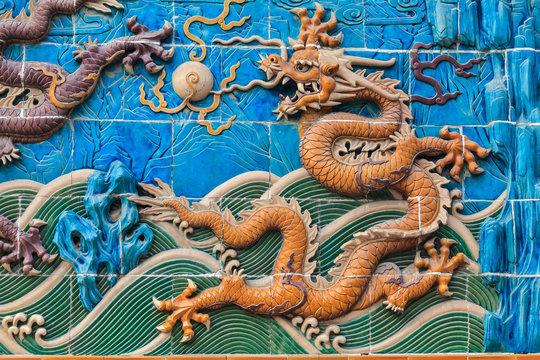 Yellow dragon figure on the wall in Beijing