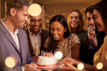 Group Of Friends Celebrating Birthday With Party At Home