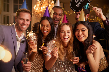 Group Of Friends Celebrating At New Year Party Together
