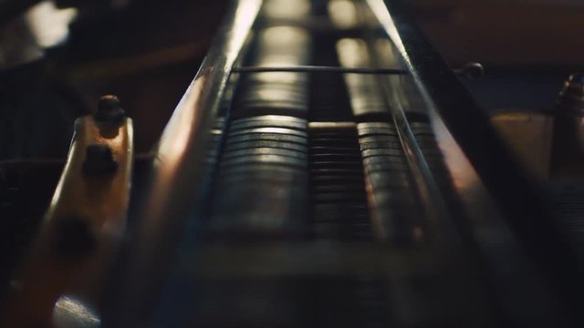 Inside the playing piano. Piano hammers playing.