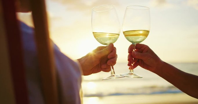 Couple Watching Sunset Enjoying a Glass of Wine