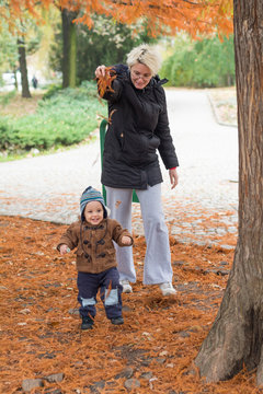 Mother and son in at autumn park