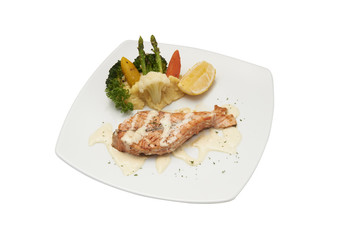 Isolated of Salmon steak with cream sauce.