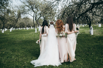 Beautiful bride with her pretty bridesmaids