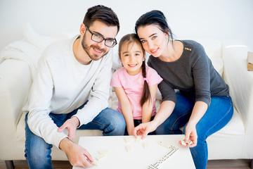 Family playing domino