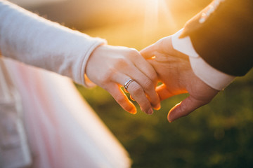 Wedding couple are looking to the sunset