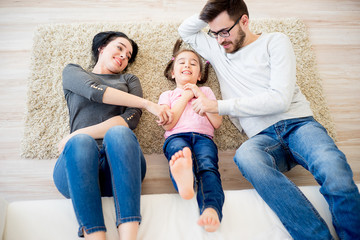 Family lying on floor
