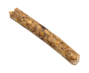 A single wood pellet used for heating isolated on a white background.